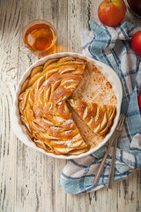 Heap of homemade apple pie close-up and copy space. A quick autumn dessert idea with tea. Autumn...