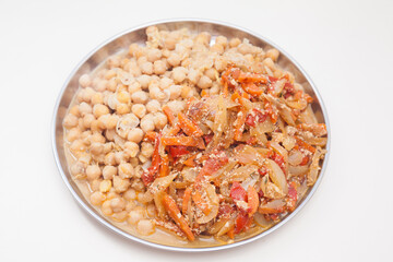 Plate with cooked chickpeas and vegetable ragout