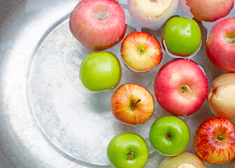 Washing fresh apples in the water