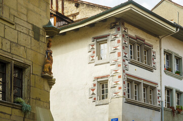 Naklejka premium religious statue on the corner of a building in Fribourg, Switzerland