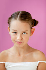 .the girl looks with disbelief or disappointment