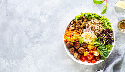 Grilled chicken, rice, spicy chickpeas, avocado, cabbage, pepper buddha bowl on white background, top view. Delicious balanced food concept