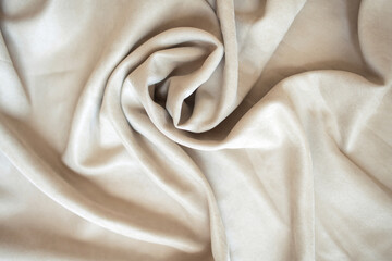 Velour background with drapery the color of coffee and milk. Blackout curtains on velour background with pleats.