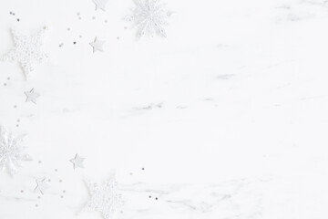 Christmas composition. Silver decorations on marble background. Christmas, winter, new year concept. Flat lay, top view, copy space