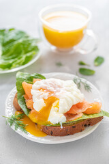 delicious poached egg with salmon fish and orange juice