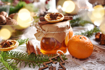 Obraz na płótnie Canvas slices of mandarin in syrup in a jar for Christmas