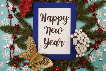 Happy New Year card with Christmas Oranament decoration on blue background