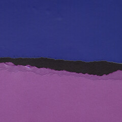 Colorful torn paper collage close-up. Texture made from various paper and cardboard parts. Damaged...