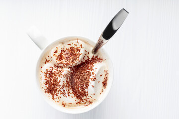 Hot chocolate and marshmallow sprinkled with chocolate chips.