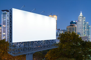 Blank white road billboard with Bangkok cityscape background at night time. Street advertising poster, mock up, 3D rendering. Side view. The concept of marketing communication to sell idea.