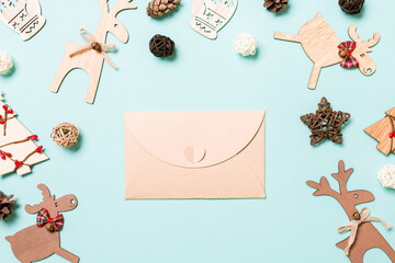 Top view of envelope on blue background. New Year decorations. Christmas holiday concept