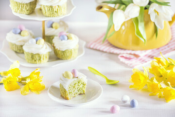 Fototapeta na wymiar Green Easter cupcakes with colourful eggs