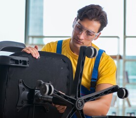 Furniture repairman working on repairing the chair