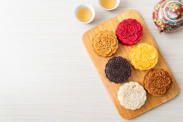 colourful Chinese moon cake on wood plate
