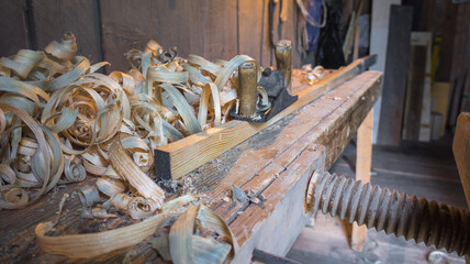 Wood shavings from an old plane on the workbench