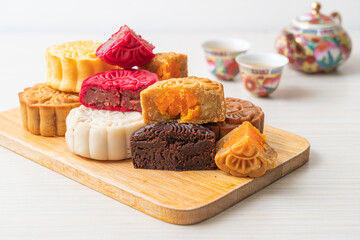 colourful Chinese moon cake on wood plate