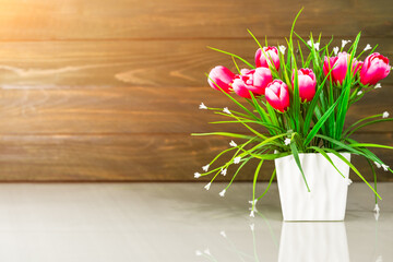 Artificial flower vase bouquet over table