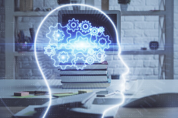 Double exposure of work space with computer and human brain drawing hologram. Brainstorm concept.