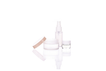 Set of transparent cosmetic bottle and jars with liquids isolated on white background. Beauty,...