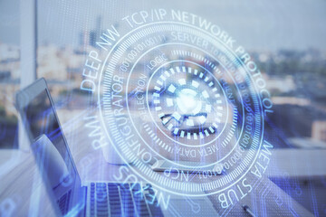 Double exposure of desktop computer and technology theme hologram. Concept of software development.