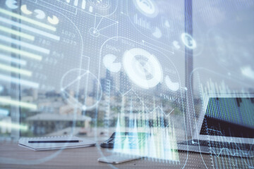 Double exposure of desktop computer and technology theme hologram. Concept of software development.