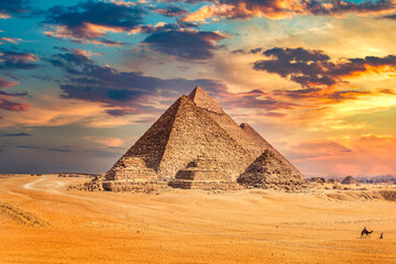 Egyptian pyramids at sunset - obrazy, fototapety, plakaty