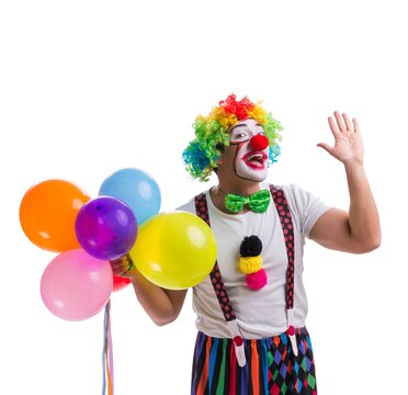 Funny clown with balloons isolated on white background
