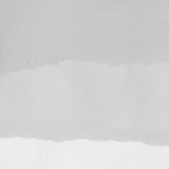 White torn paper collage close-up. Texture made from various paper and cardboard parts. Damaged old paper background. Vintage blank wallpaper. Material design backdrop.