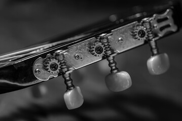 Tuning mechanics of a guitar in detail, detailed photo of tuning screws of a guitar, guitar...