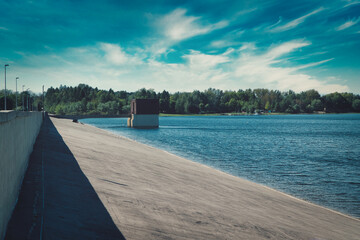 Reservoir. A lake surrounded by a flood bank, a lagoon or a dam. The concept of resting by the water.