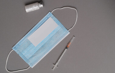 Syringe and vaccine. Coronavirus epidemic.