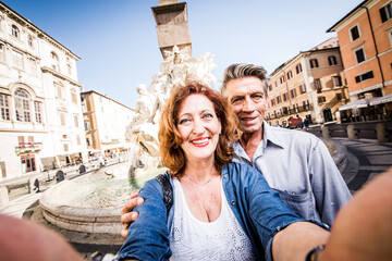 Fototapeta na wymiar Senior couple of tourist on vacation in Rome