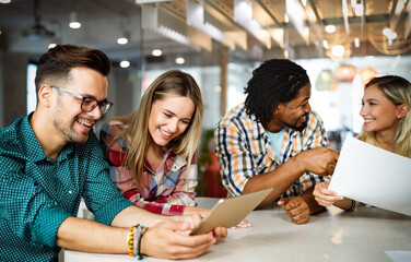 Business people having fun and chatting at workplace office