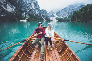 Mountain stories. Happy couple on a wanderlust vacation. © oneinchpunch
