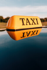 Taxi sign on cab car roof