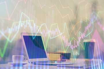 Forex Chart hologram on table with computer background. Double exposure. Concept of financial markets.