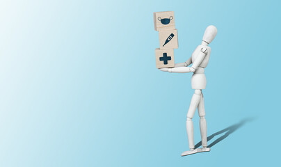 Mannequin with wooden cubes with medical icons. Medical and pharmaceutical concept. Taking care of health, health care.