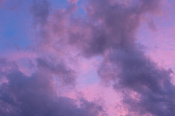 Sky at sunset with fluffy clouds