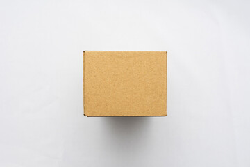 Cardboard brown box, white background, top view, copy space