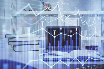 Stock market chart hologram drawn on personal computer background. Double exposure. Concept of investment.