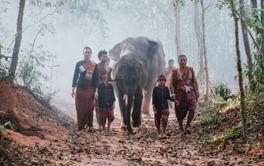 thai shepherds in the jungle with  elephants. Historic lifestyle moments from thailand culture