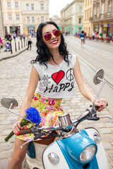 Fototapeta na wymiar young beautiful woman riding on motorbike city street, summer europe vacation, traveling, smiling, happy, having fun, sunglasses, stylish outfit, adventures, hipster outfit
