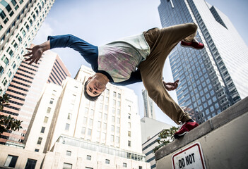 Man performing parkour tricks in the urban center