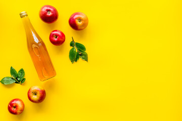 Apple cider vinegar in bottle with fruits top view