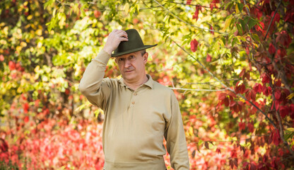 Obraz premium Mature European or American man at nature, philosophical portrait, older senior outdoor 