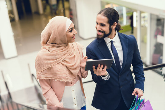 Young Arabian Couple Shopping in Modern Mall.