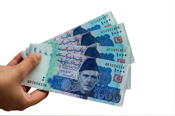 Pakistani 1000 Note hold in hand, Isolated on white background