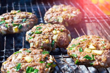 Burger Patties Cooking on Smoking Barbecue Grill. cooking meat on coals. selective focus