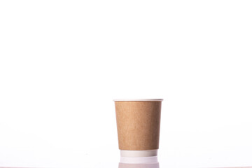 Eco-friendly disposable brown kraft paper cup isolated on white background. Coffee to go, takeaway hot drinks, cafe, restaurant, Recycling, tableware concept, mockup template. Copy space