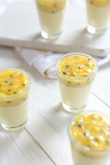 Summer passion fruit and white chocolate desserts in glasses